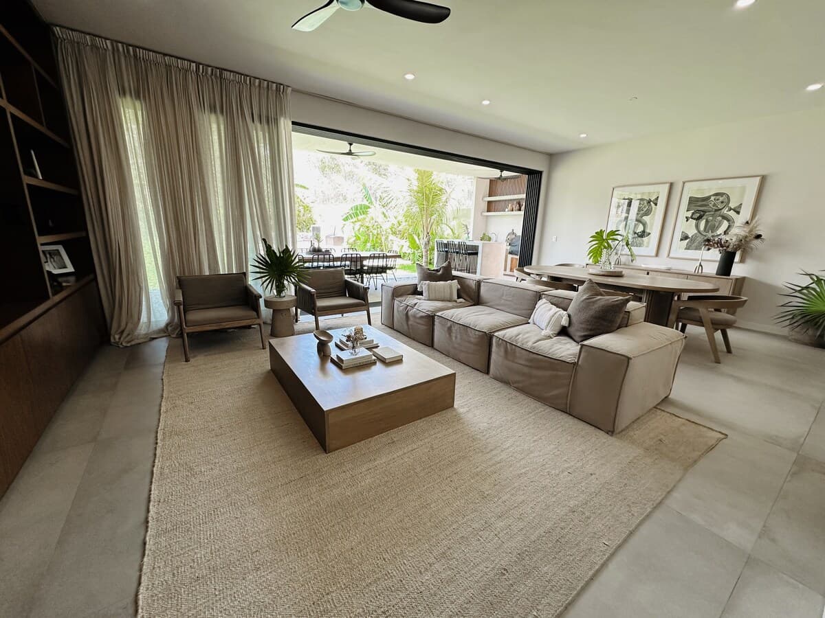 Living room with 65" TV , view to garden and pool